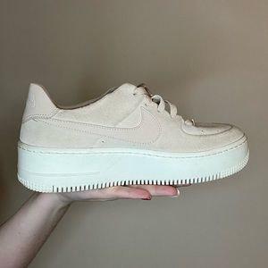 Women pink suede Nike AF1.